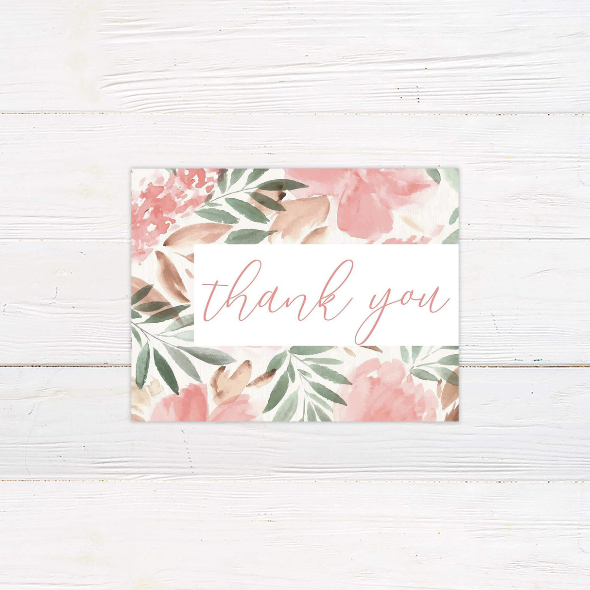 Watercolor thank you card with blush pink florals, green leaves, and romantic script and serif fonts on white background