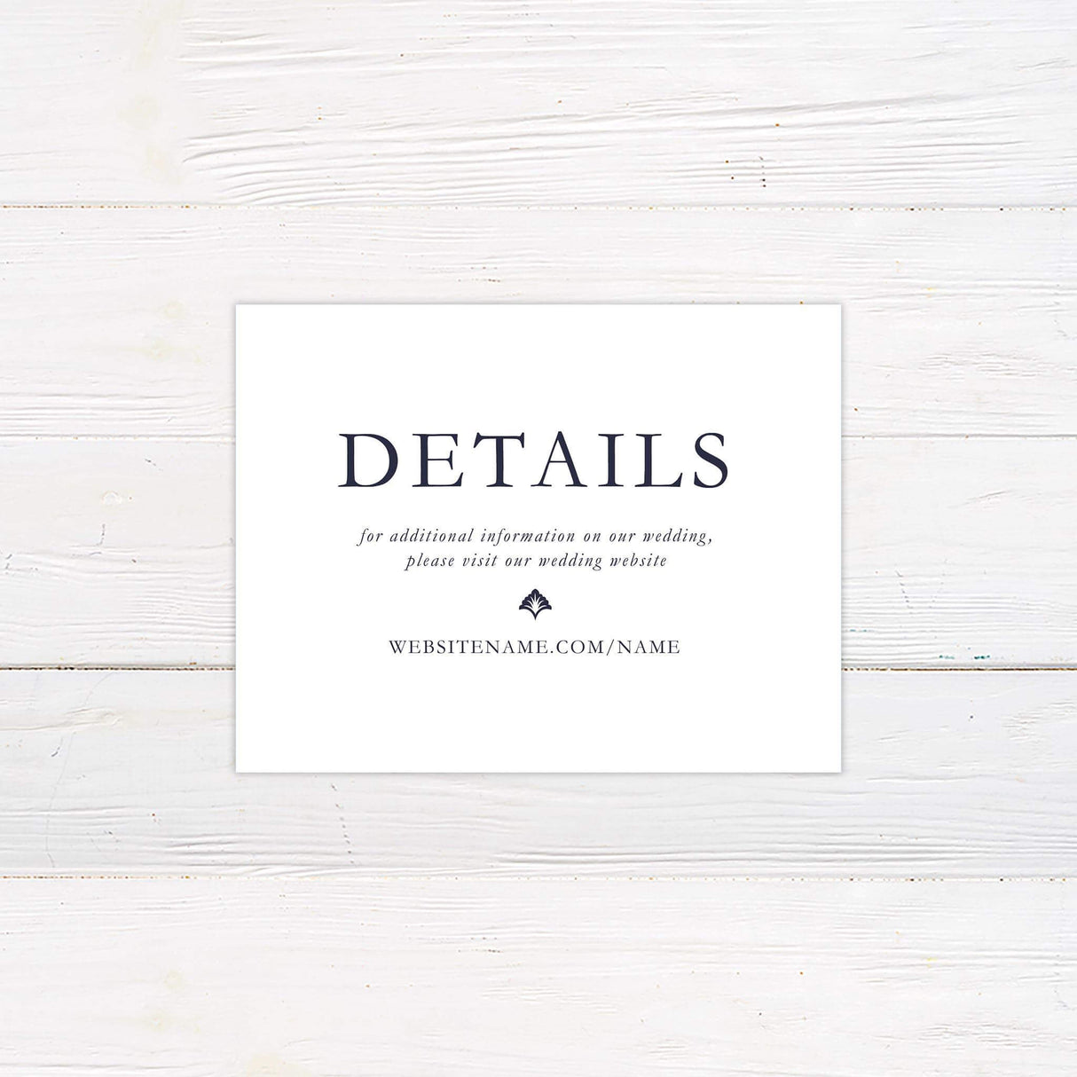 Wedding detail card featuring damask background, serif font layout, and coordinating navy and white color scheme