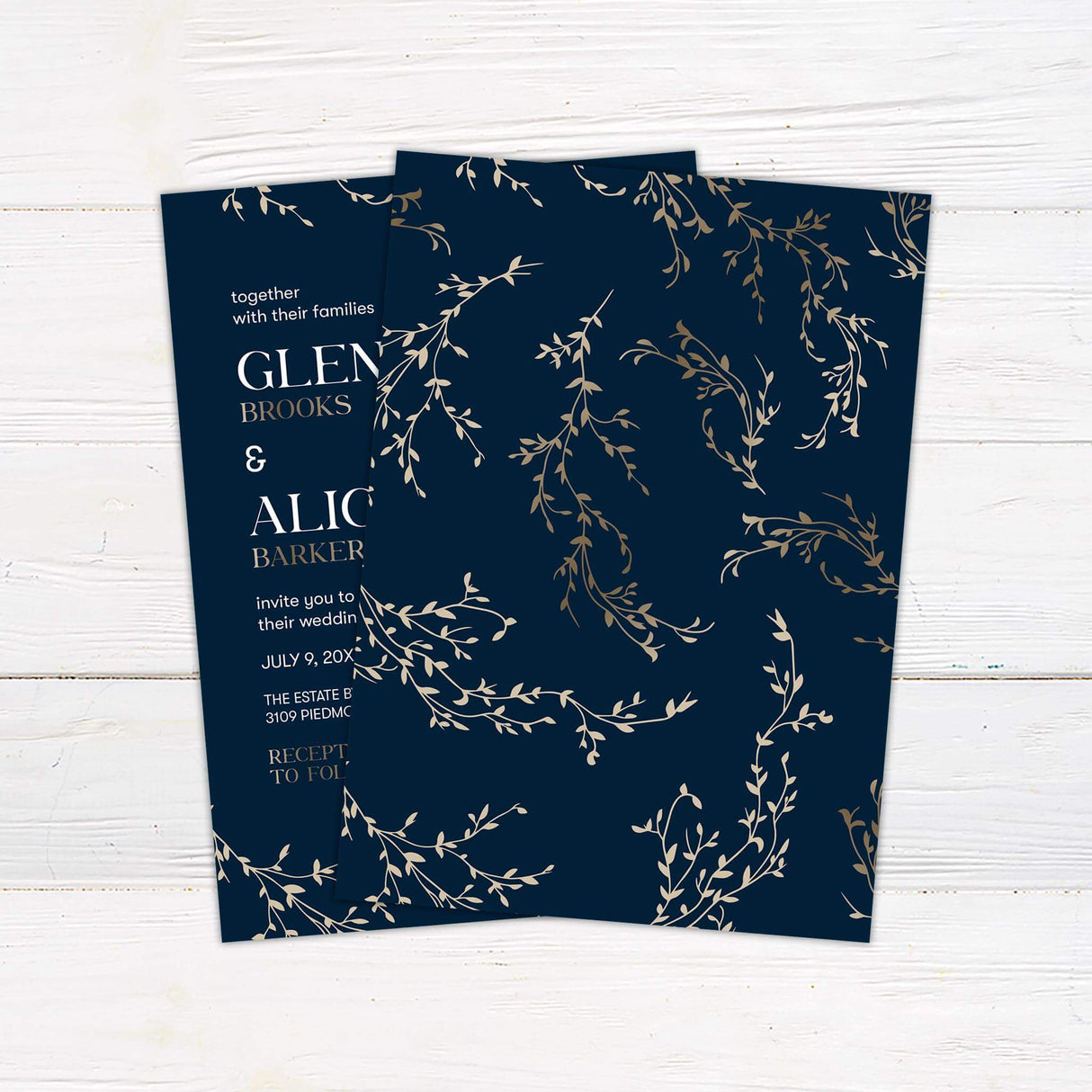 Navy and gold wedding invitation with elegant botanical branch illustrations and a modern mix of serif and sans-serif fonts - back side