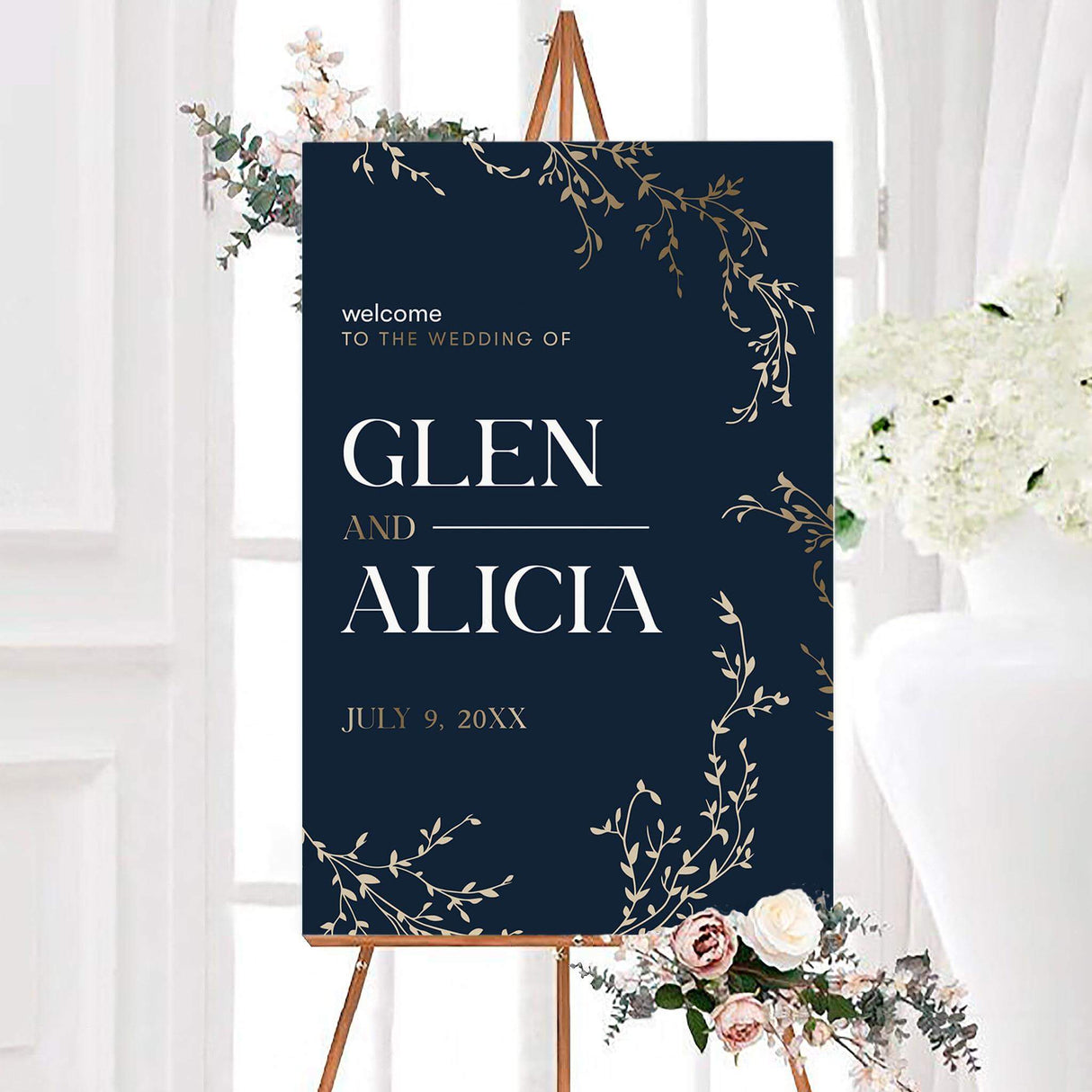 Elegant navy gold branch wedding welcome sign with gold-inspired botanical branches and large white serif lettering. The personalized design features the couple’s names and wedding date.