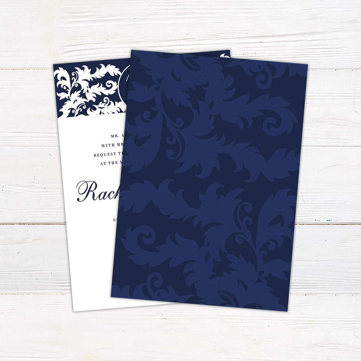 Navy and white damask wedding invitation with monogram crest and elegant script names, printed on white cardstock.- back side