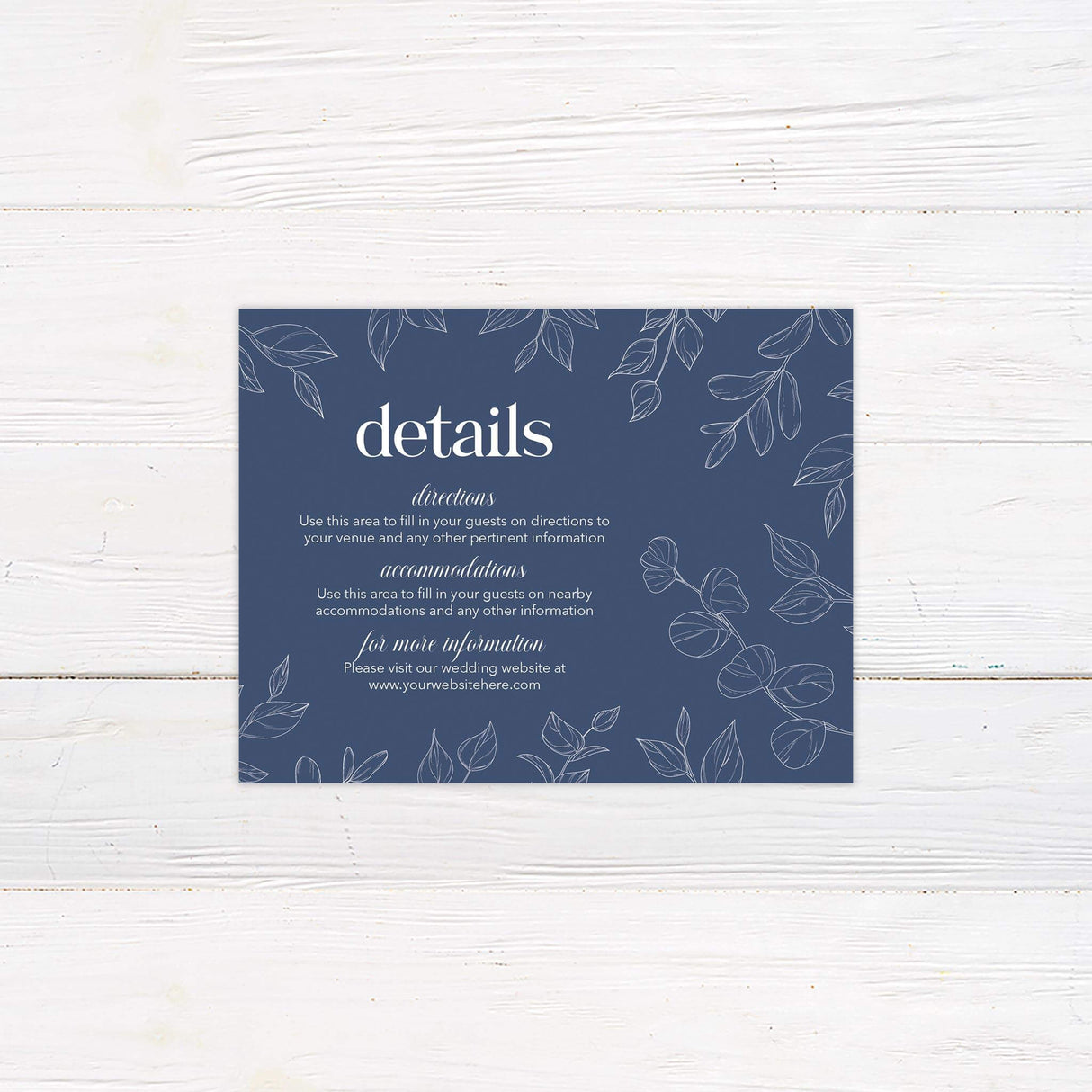 Wedding detail card featuring navy botanical border with coordinating modern text layout.
