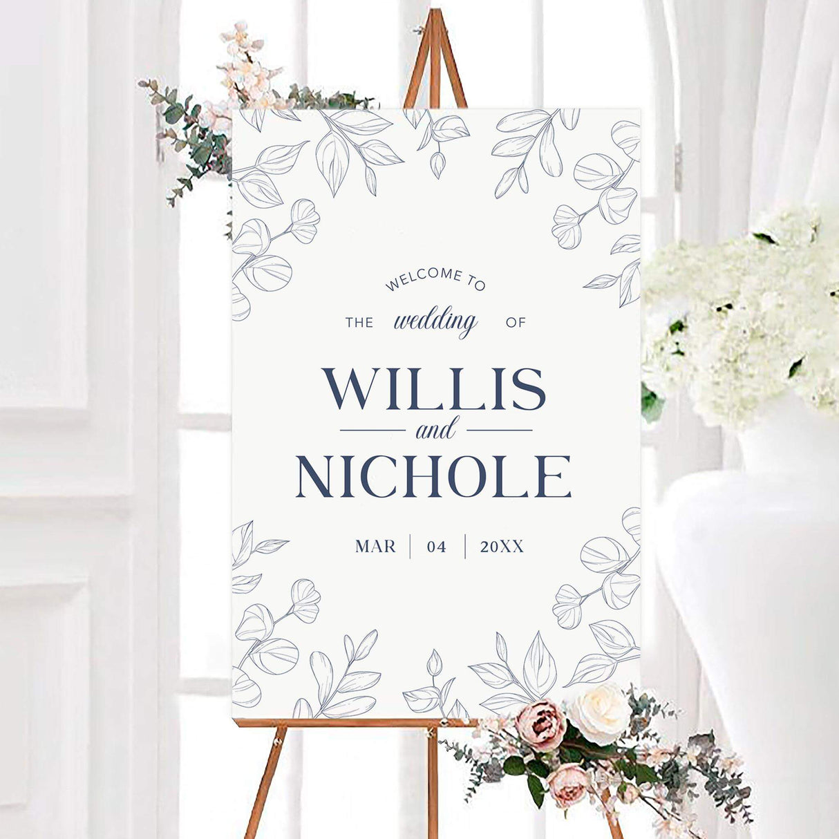 Navy outlined leaves wedding welcome sign with delicate outlined botanical leaves surrounding personalized couple names on a white background. Elegant serif and script typography displays the wedding details and date.