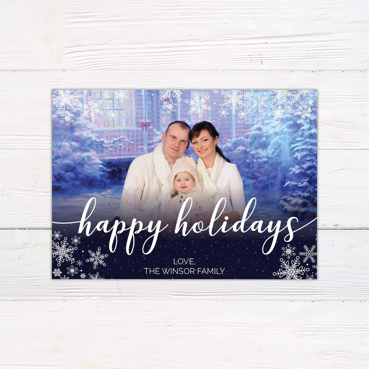 Navy Snowflakes Christmas Card with family photo and holiday greeting on a snowy background.