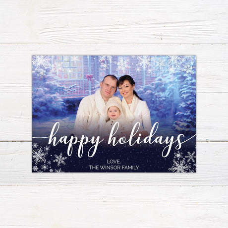 Navy Snowflakes Christmas Card with family photo and holiday greeting on a snowy background.