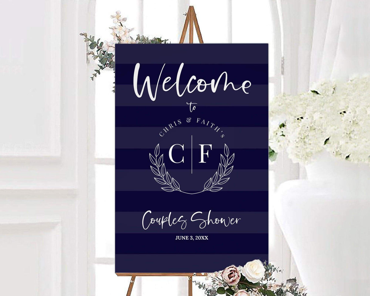 A navy stripes couples wedding shower sign with white text and leaf accents. The design has a modern and elegant layout.