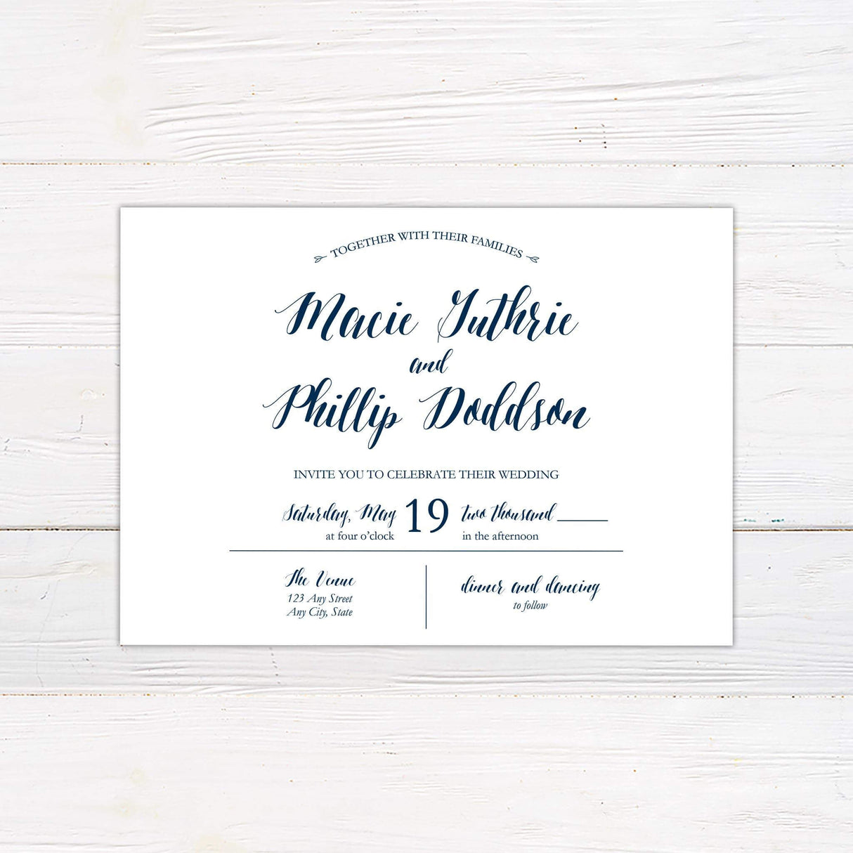 Navy and white wedding invitation with script and serif fonts, featuring a clean, modern layout on a white background with elegant navy calligraphy