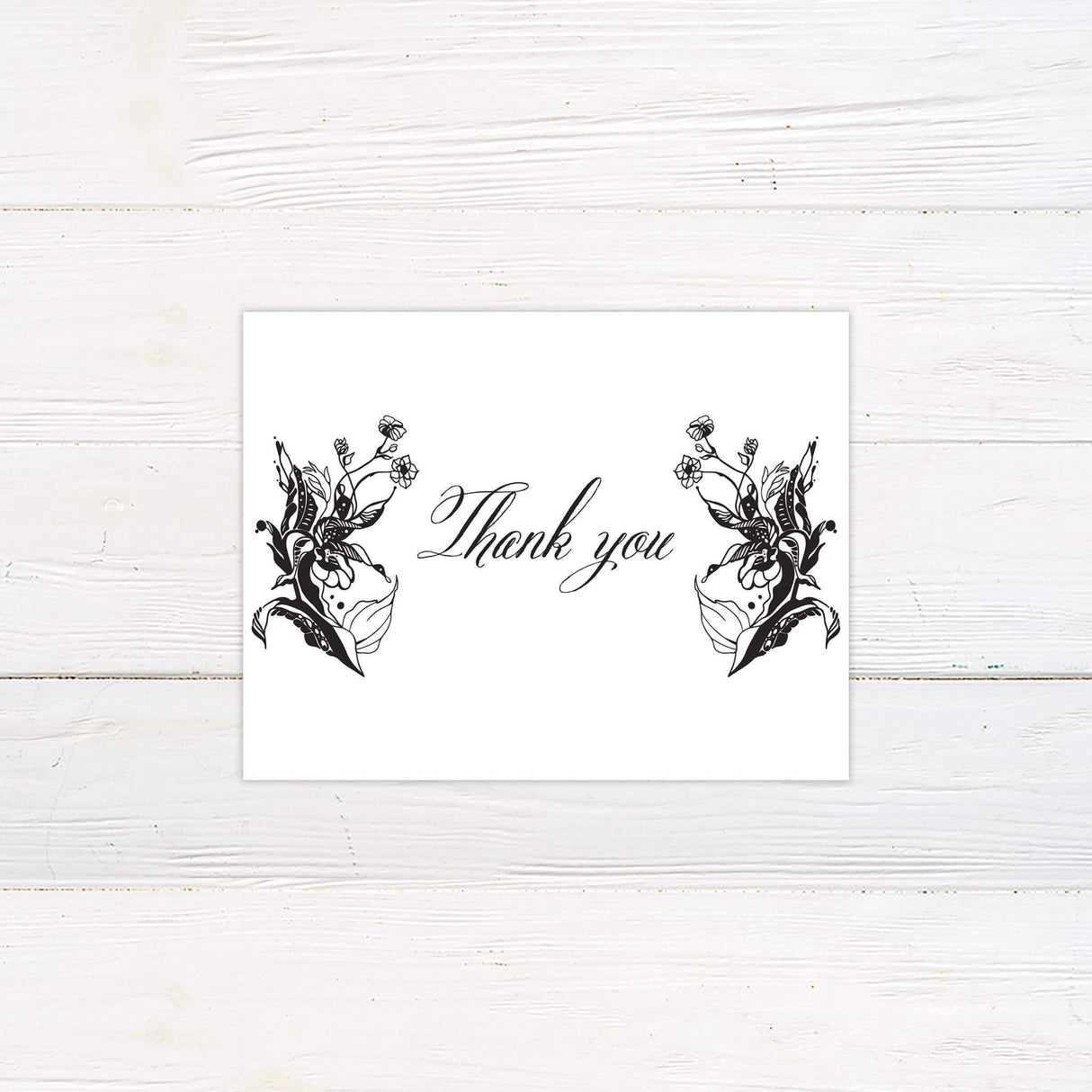 Thank you card with ornate black floral illustrations and romantic calligraphy-style message.
