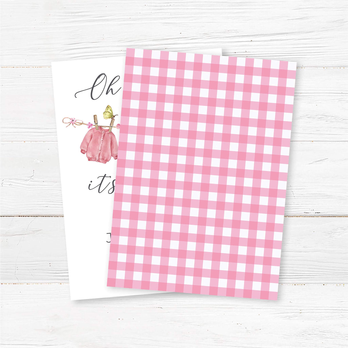 Printed baby shower invitation featuring a watercolor pink baby clothesline design with delicate floral accents. Perfect for a baby girl shower or sprinkle. back
