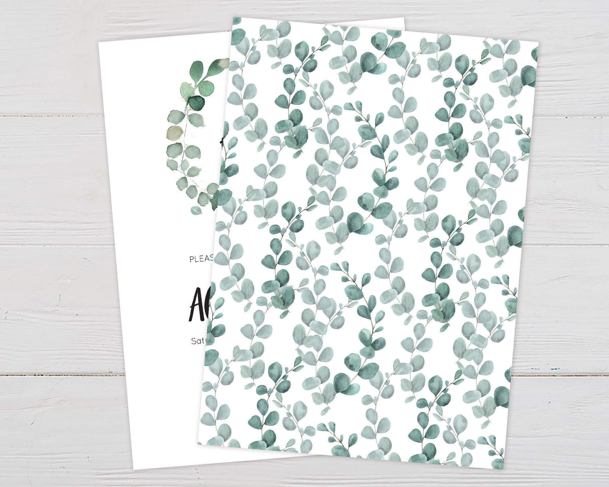 Baby shower invitation with "Oh Boy!" in bold black script inside a watercolor green eucalyptus wreath. Below, event details are written in an elegant font, including the honoree’s name, date, time, location, RSVP information, and baby registry details. The design has a minimalist white background with soft greenery accents, creating a fresh and modern look. Back.