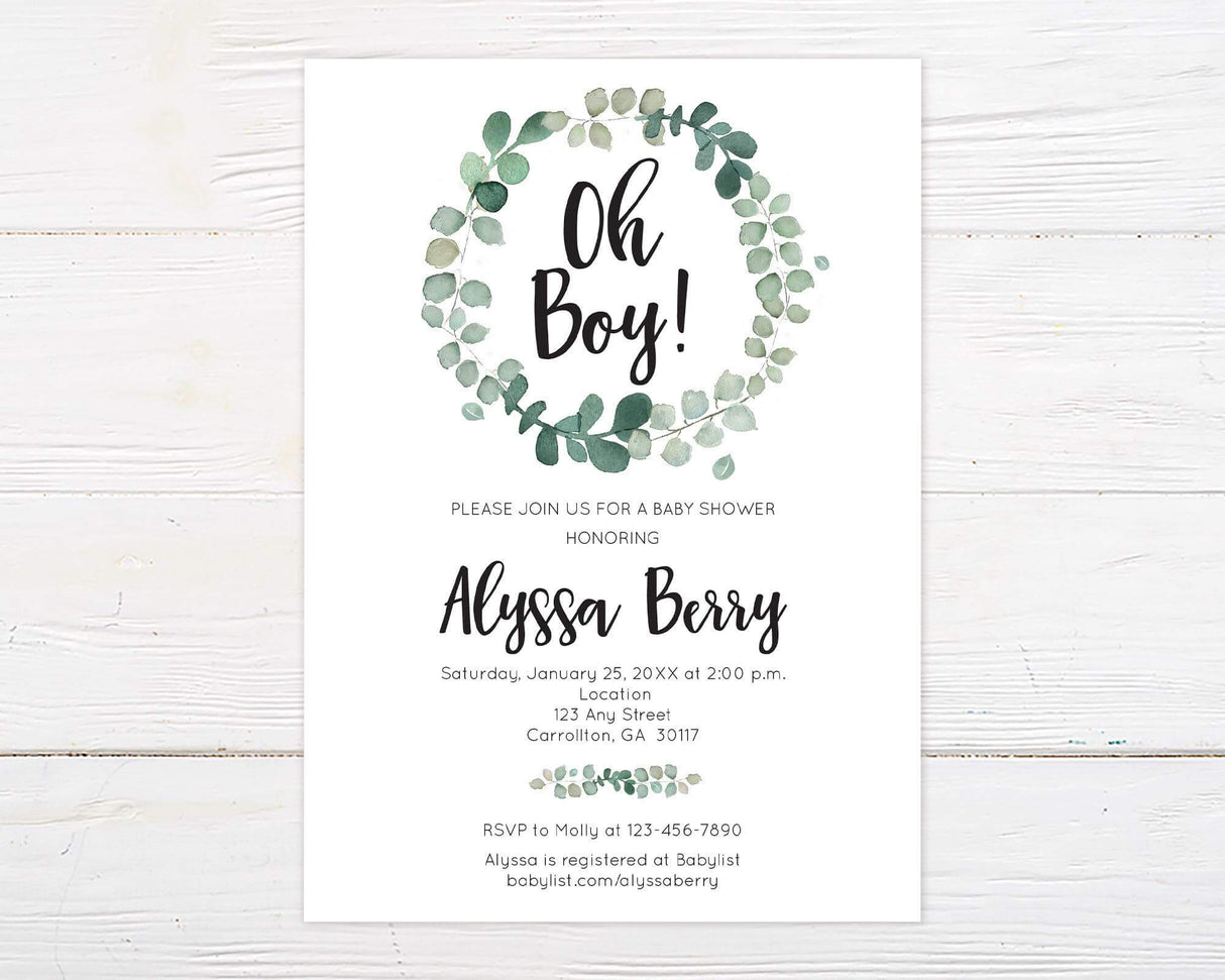 Baby shower invitation with "Oh Boy!" in bold black script inside a watercolor green eucalyptus wreath. Below, event details are written in an elegant font, including the honoree’s name, date, time, location, RSVP information, and baby registry details. The design has a minimalist white background with soft greenery accents, creating a fresh and modern look.