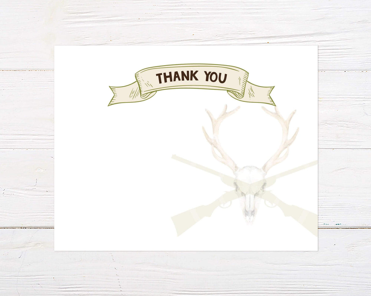 Thank you card with a rustic hunting theme, featuring a deer skull with antlers and crossed rifles in soft watercolor tones. A green ribbon banner with bold "Thank You" text adds a vintage outdoorsy touch.