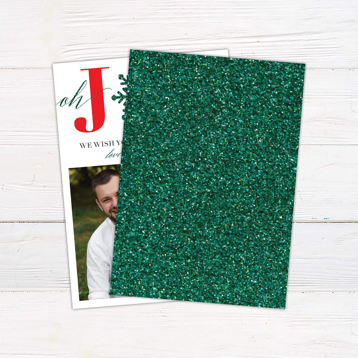 A holiday card design featuring the word “JOY” with a green snowflake, along with a family photo. A festive and customizable Christmas greeting. - back.