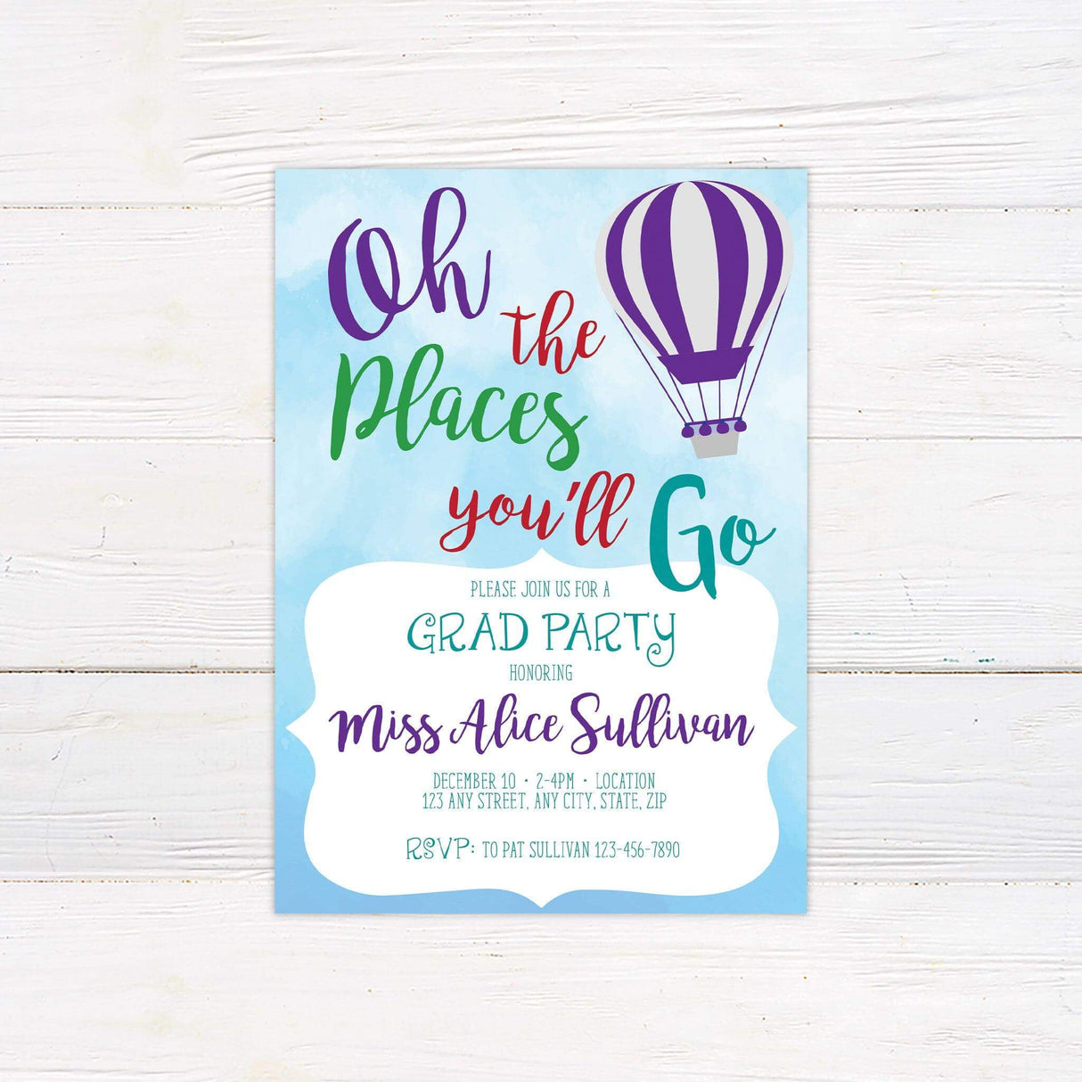Graduation party invitation with a sky-blue watercolor background, colorful typography reading "Oh, the Places You'll Go," and an orange hot air balloon. Features event details in a stylish mix of script and print fonts, creating a cheerful and festive design.