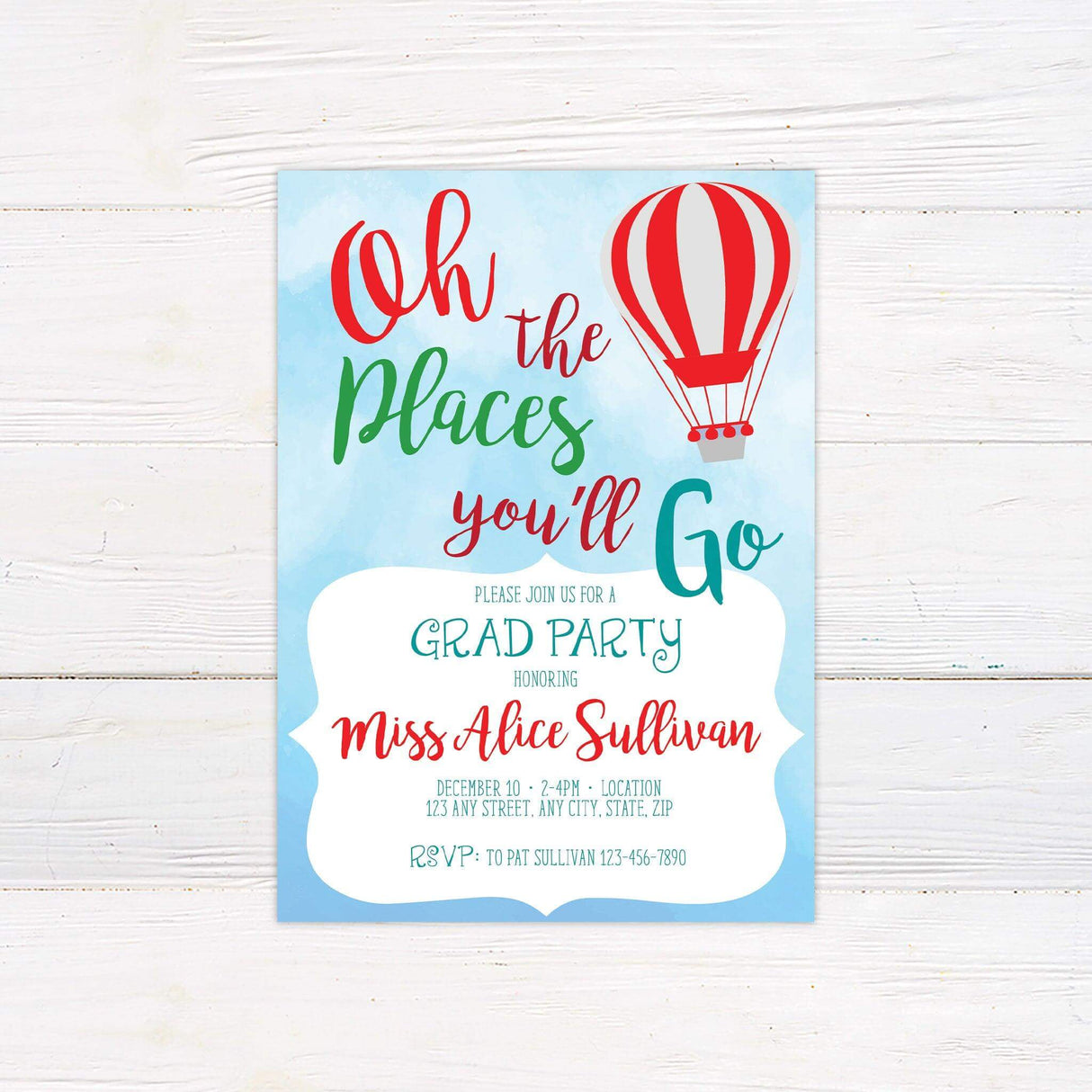 Graduation party invitation with a sky-blue watercolor background, colorful typography reading "Oh, the Places You'll Go," and an orange hot air balloon. Features event details in a stylish mix of script and print fonts, creating a cheerful and festive design.