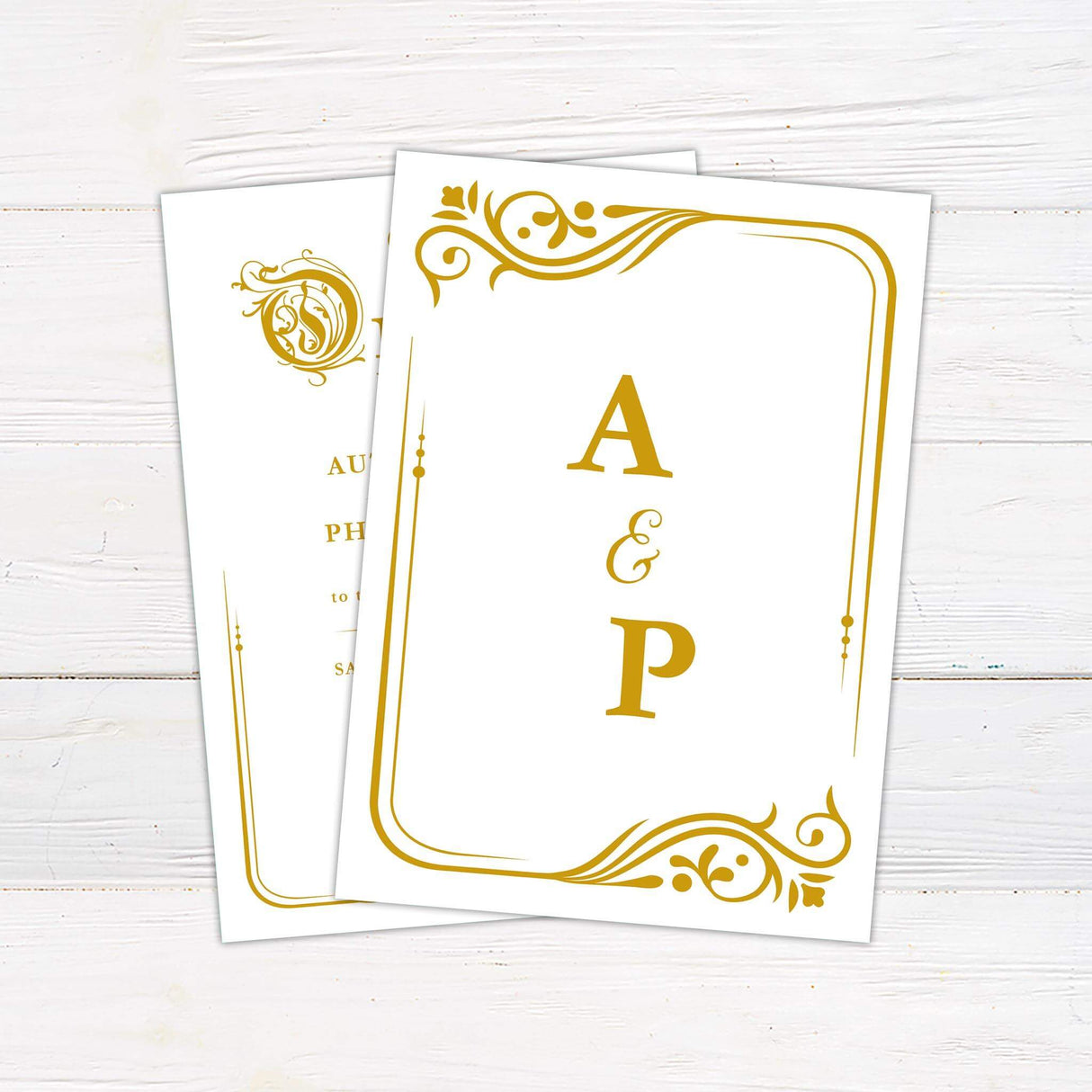 Fairy tale wedding invitation with “Once Upon a Time” script in gold and ornate storybook flourishes on a white background.- back side