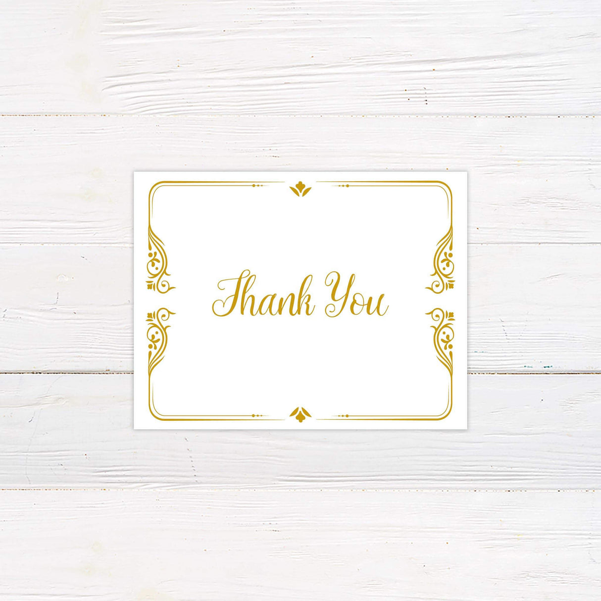 Thank you card with whimsical gold typography and elegant embellishments to match the storybook suite.