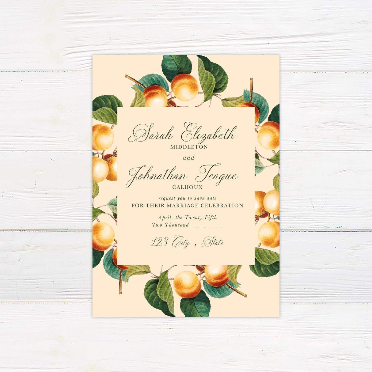 Save the date card with watercolor oranges and green leaves, paired with classic fonts on a warm cream background.