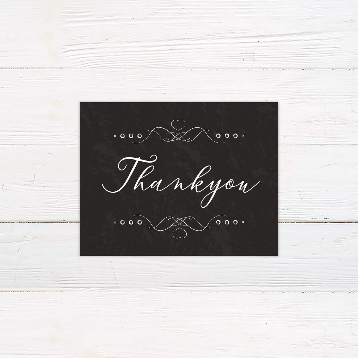 Thank you card with ornate white design and hand-drawn chalkboard theme elements.