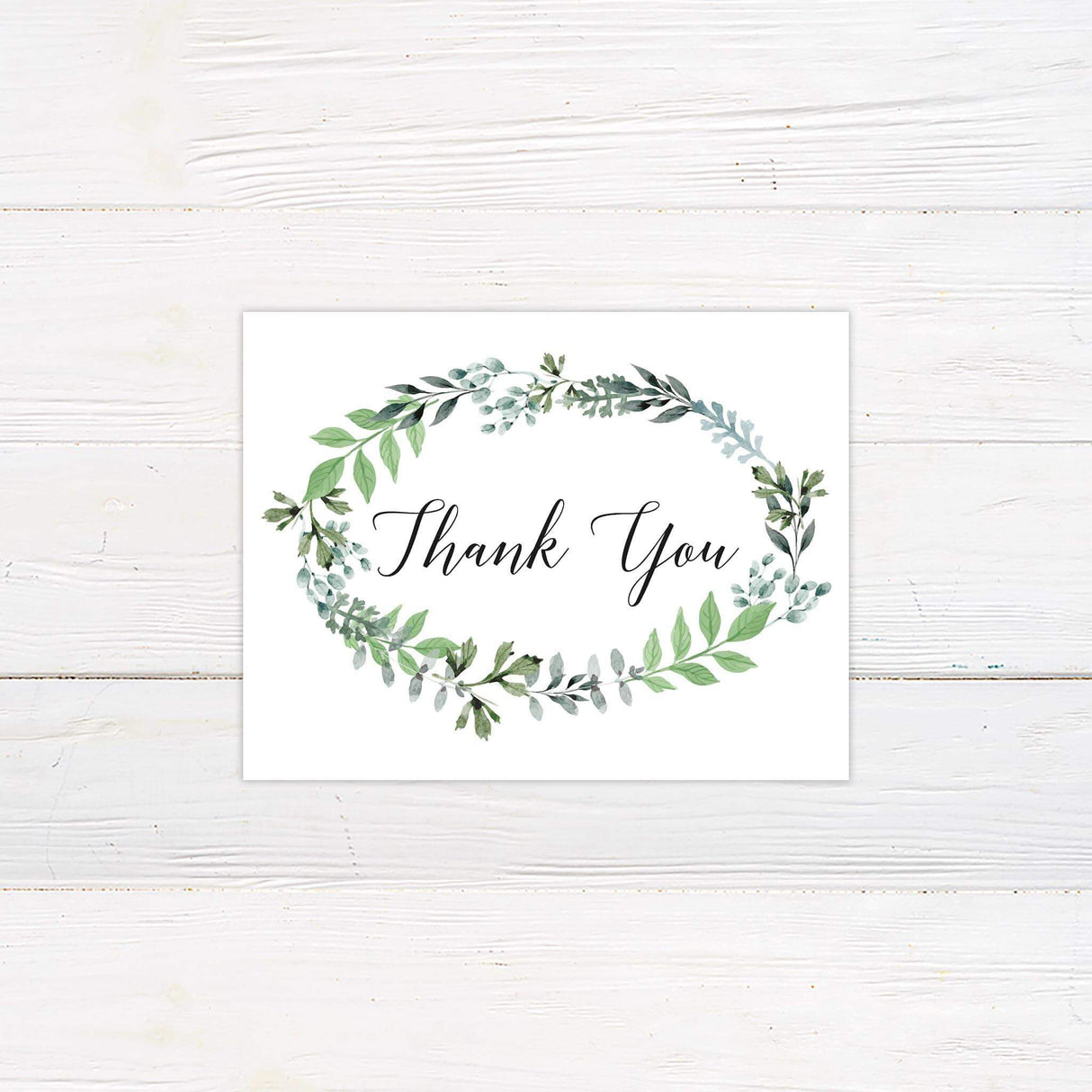 Thank you card with watercolor leaf border in green tones and refined script and serif font pairing