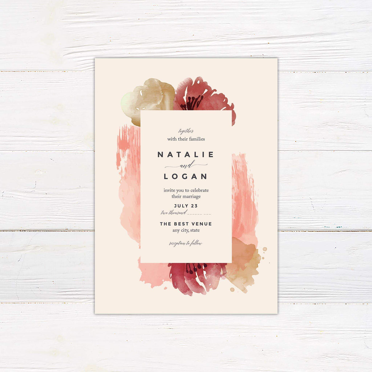 Wedding invitation with abstract watercolor florals in red and blush tones, featuring bold serif fonts on a cream background.