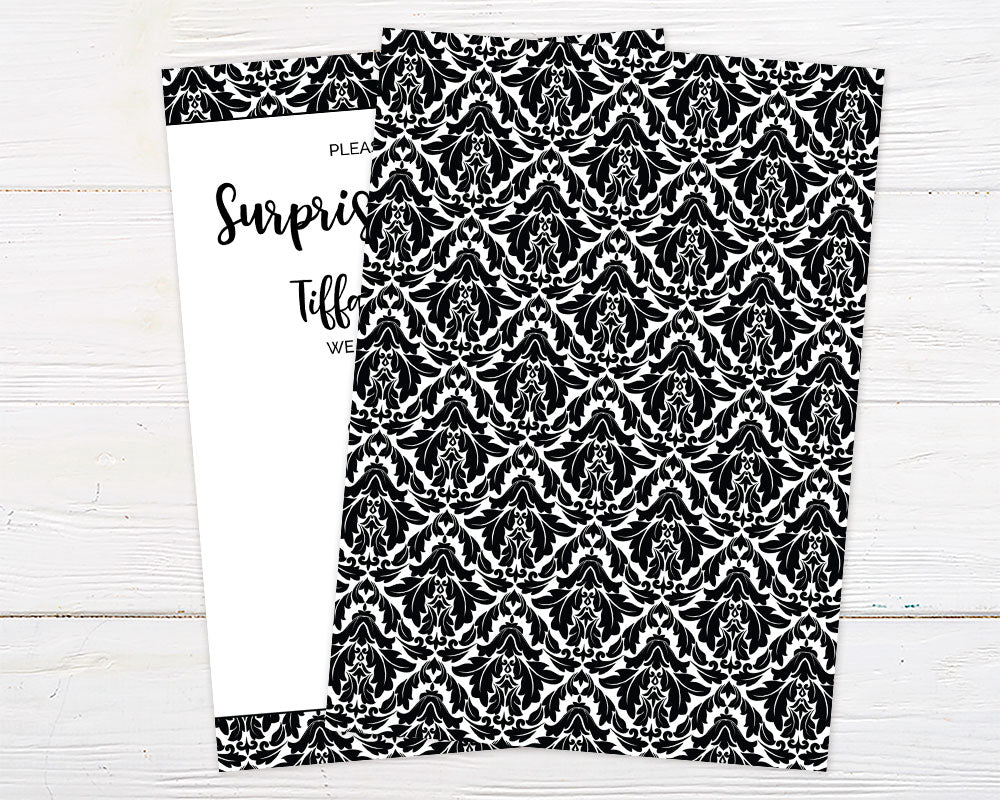 Paisley Birthday Party invitation with vintage scroll pattern and damask background on a white wooden surface.