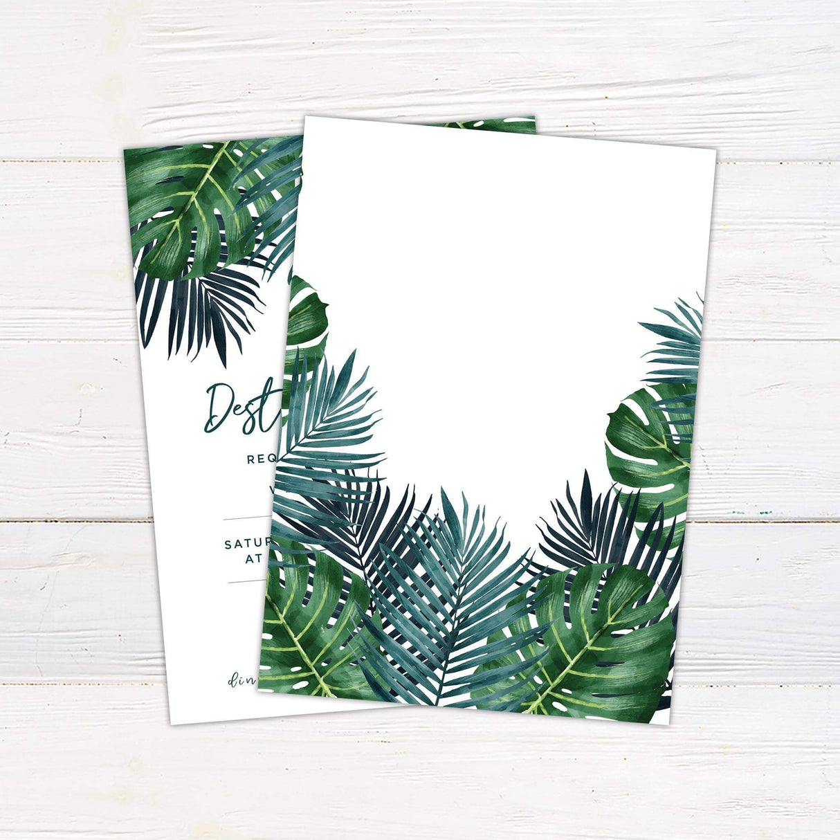 Tropical wedding invitation with green watercolor palm leaves and modern script fonts on a clean white background. - back side