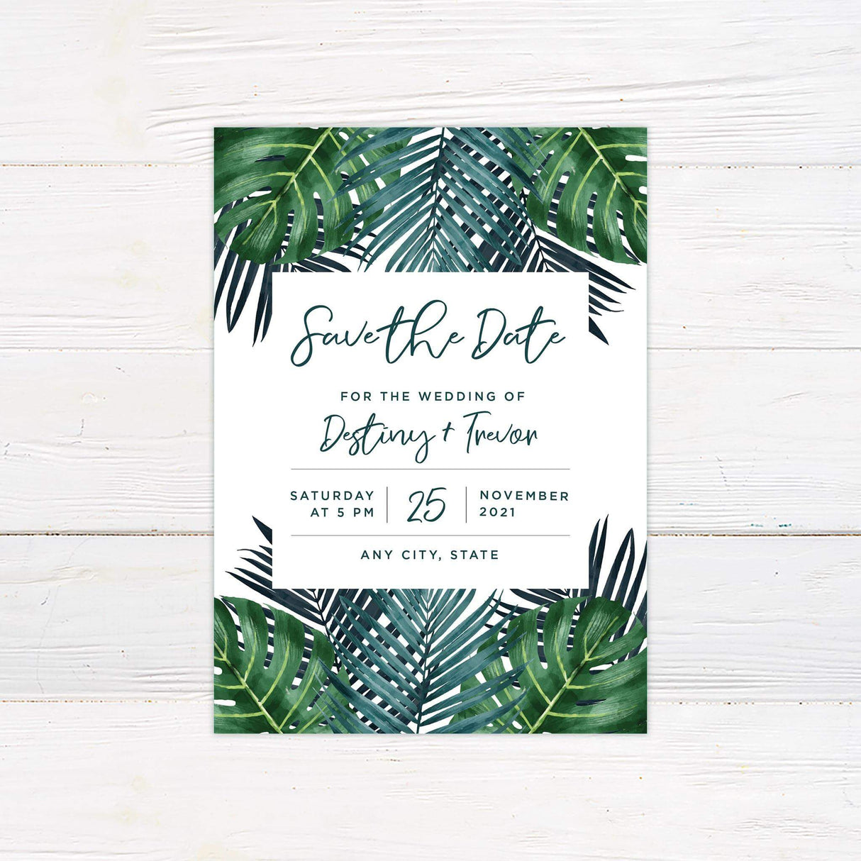Save the date card with bold palm greenery and simple modern fonts, ideal for beach or destination weddings.