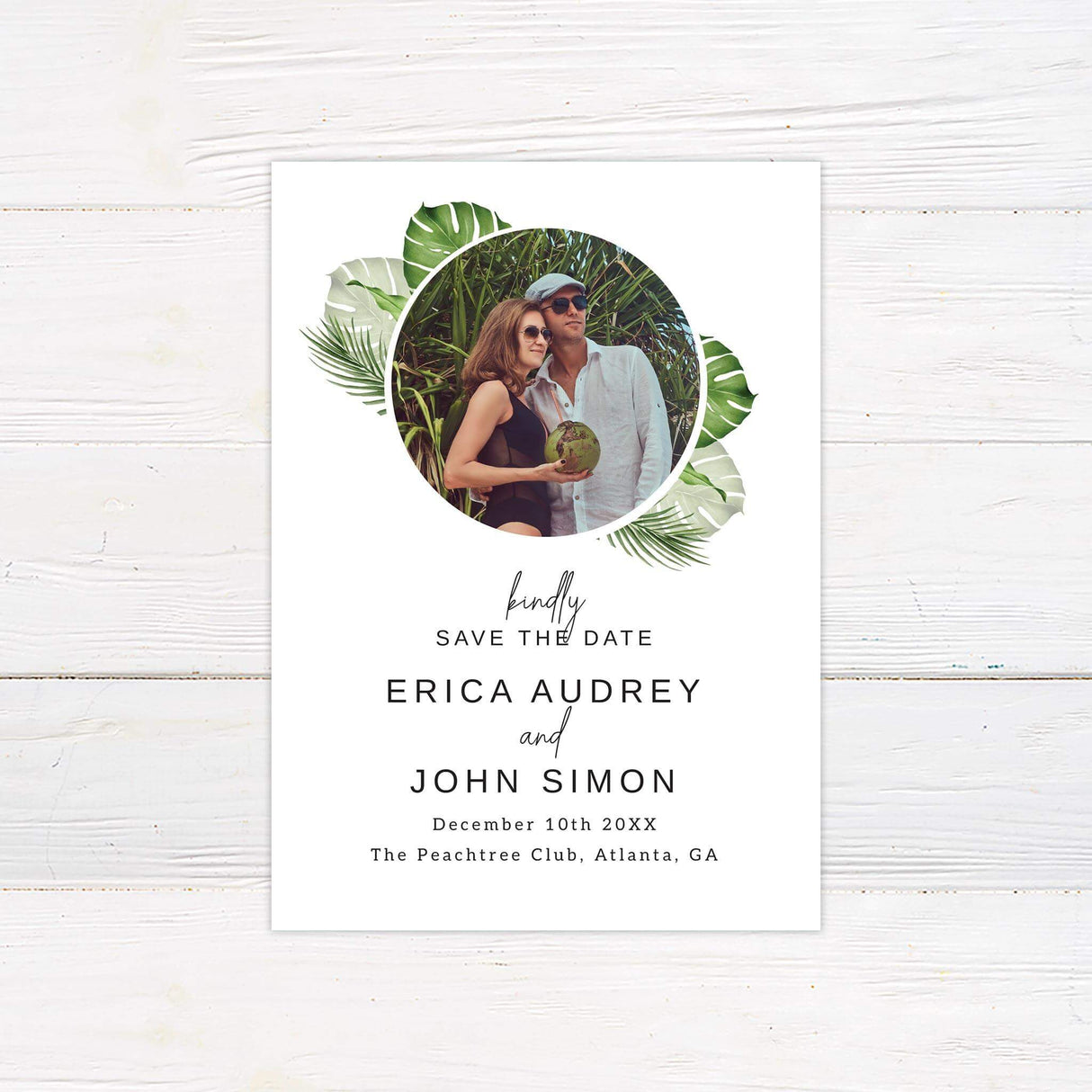 Save the date card with green watercolor palm leaves and modern text, perfect for tropical or destination weddings.