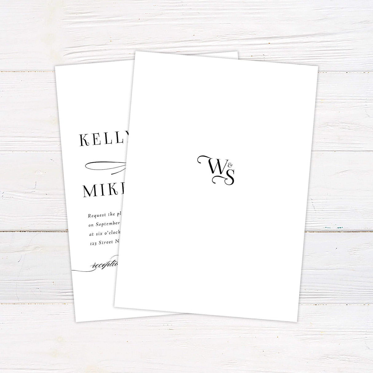 Simple script invitation with mixed fonts. Names of bride and groom in all caps and a simple font with the word and in Calligraphy in between.