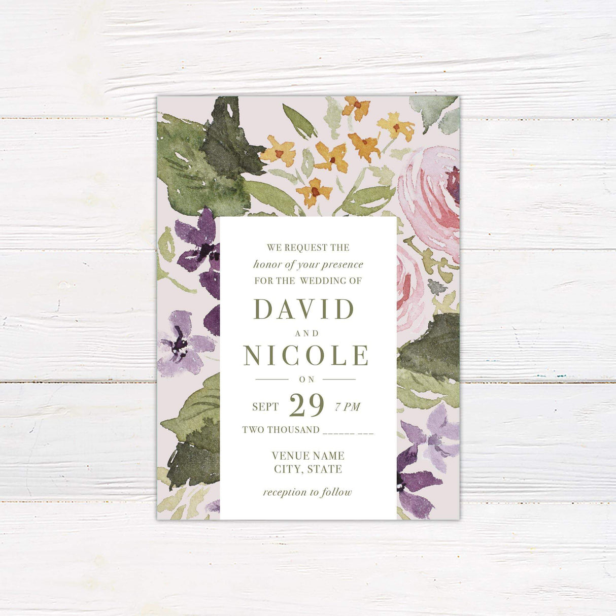 A wedding invitation with a soft neutral background features a bold watercolor floral design in shades of green, purple, pink, and gold. The text is centered within a clean white rectangular box, using a mix of serif and script fonts for an elegant and timeless feel. Event details, including the date, time, and venue, are clearly displayed in a structured layout. This design exudes a romantic and artistic charm, perfect for a garden, vintage, or floral-themed wedding celebration.
