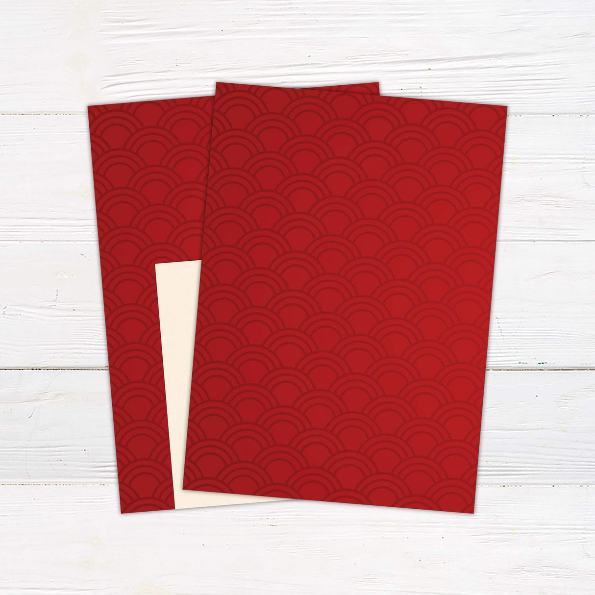 Wedding invitation with red geometric Art Deco fan pattern, cream center panel, and modern serif and script fonts.- back side