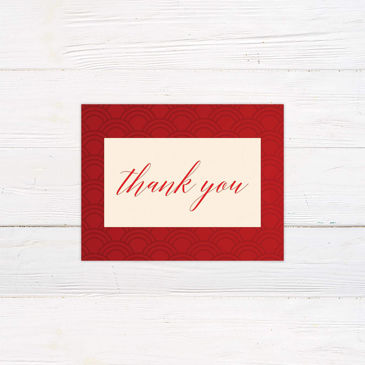 Thank you card with red pattern design and modern typography on a cream background for a bold, elegant finish.
