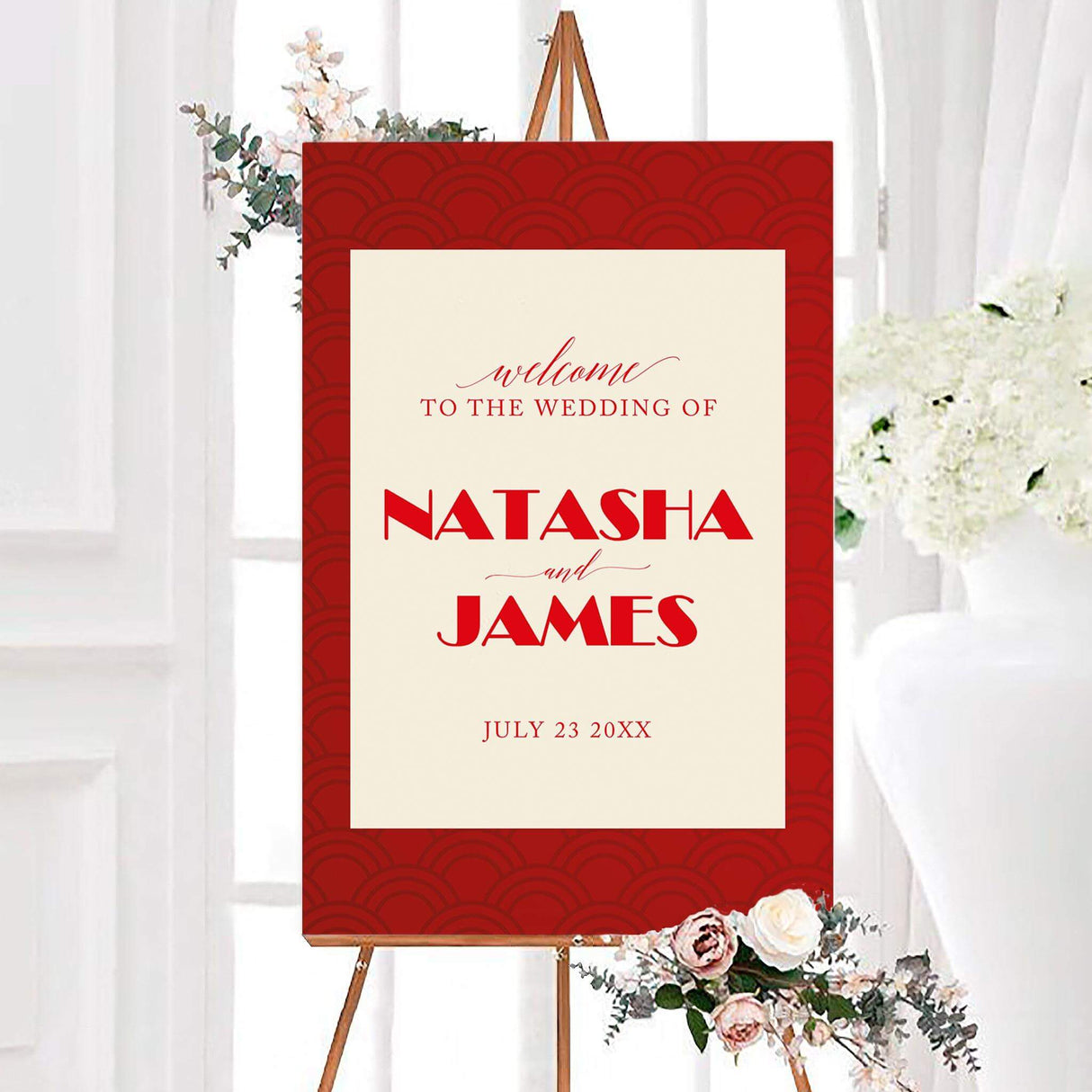 Large welcome sign with bold red geometric fan motif and modern serif fonts, ideal for formal or cultural weddings.