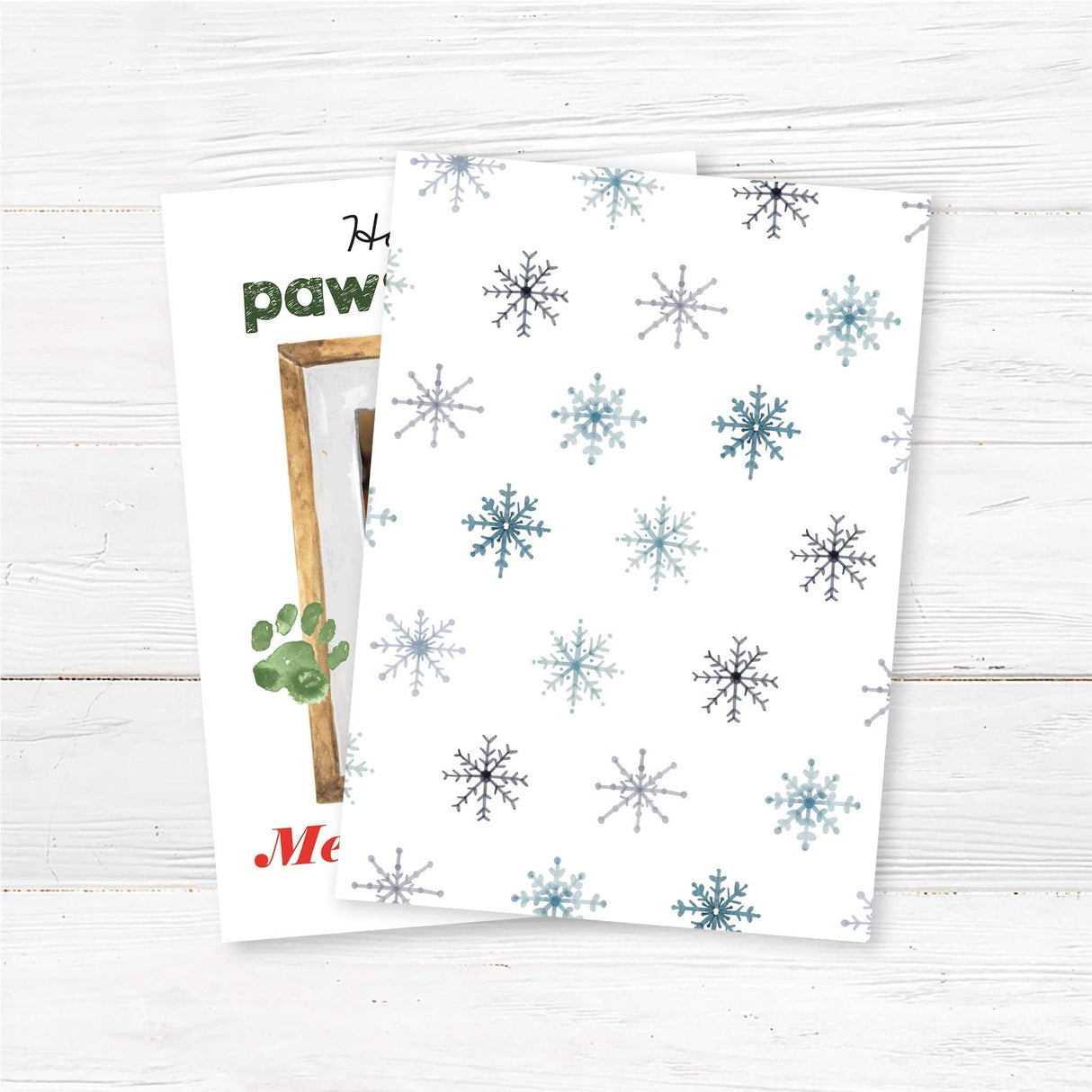 Custom pet photo Christmas card featuring a dog with reindeer antlers, watercolor paw prints, and the text "Have a Paws-itively Merry Christmas" back side