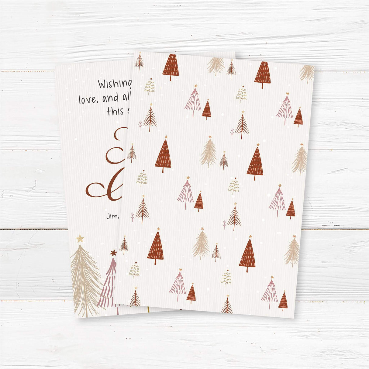 Rustic Christmas card with hand-drawn pine trees, falling snow, and customizable family name and year. - back.