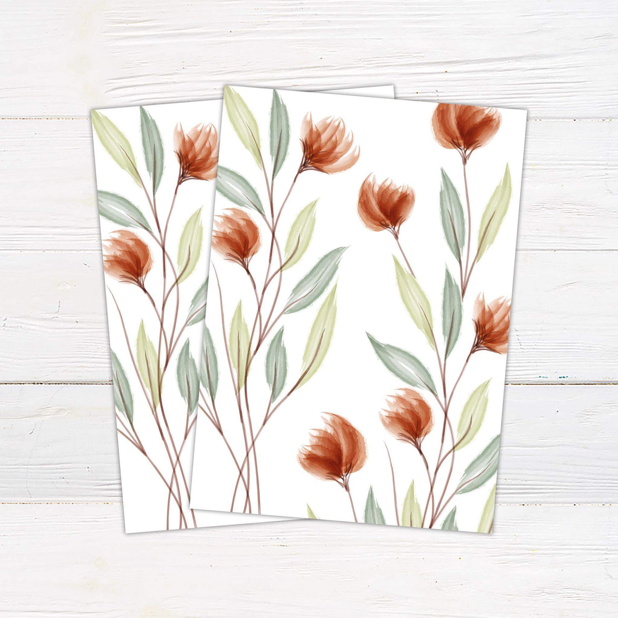 Minimalist wedding invitation with watercolor peach wildflowers and green leaves on a white background with modern serif and script fonts. - back side