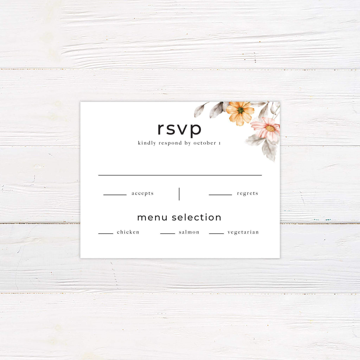 RSVP card with coordinating peach watercolor flowers in the corners and minimalist black serif text.