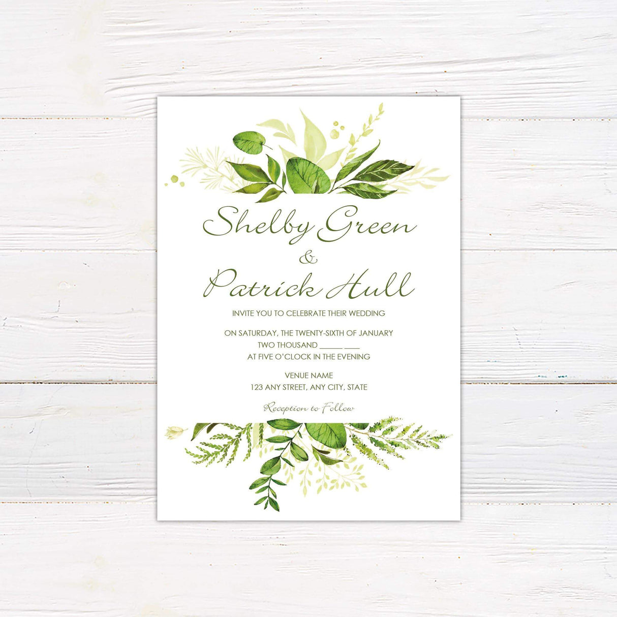 Wedding invitation with watercolor green leaves, elegant calligraphy and serif fonts on a white background.