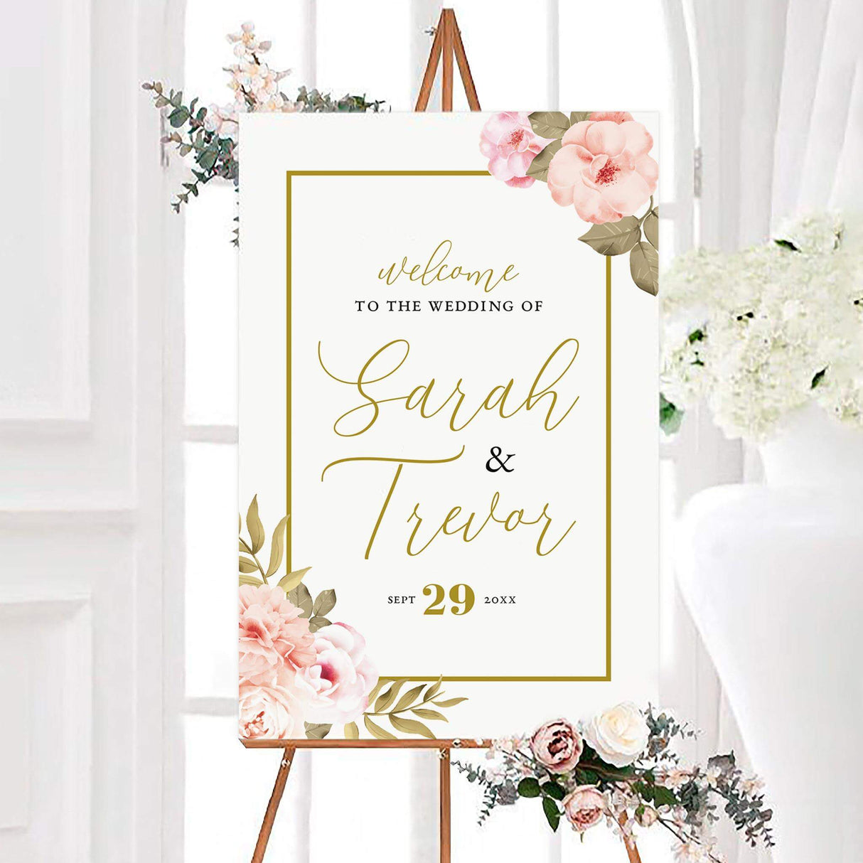Large wedding welcome sign featuring blush peony florals, gold frame accents, and romantic script text.