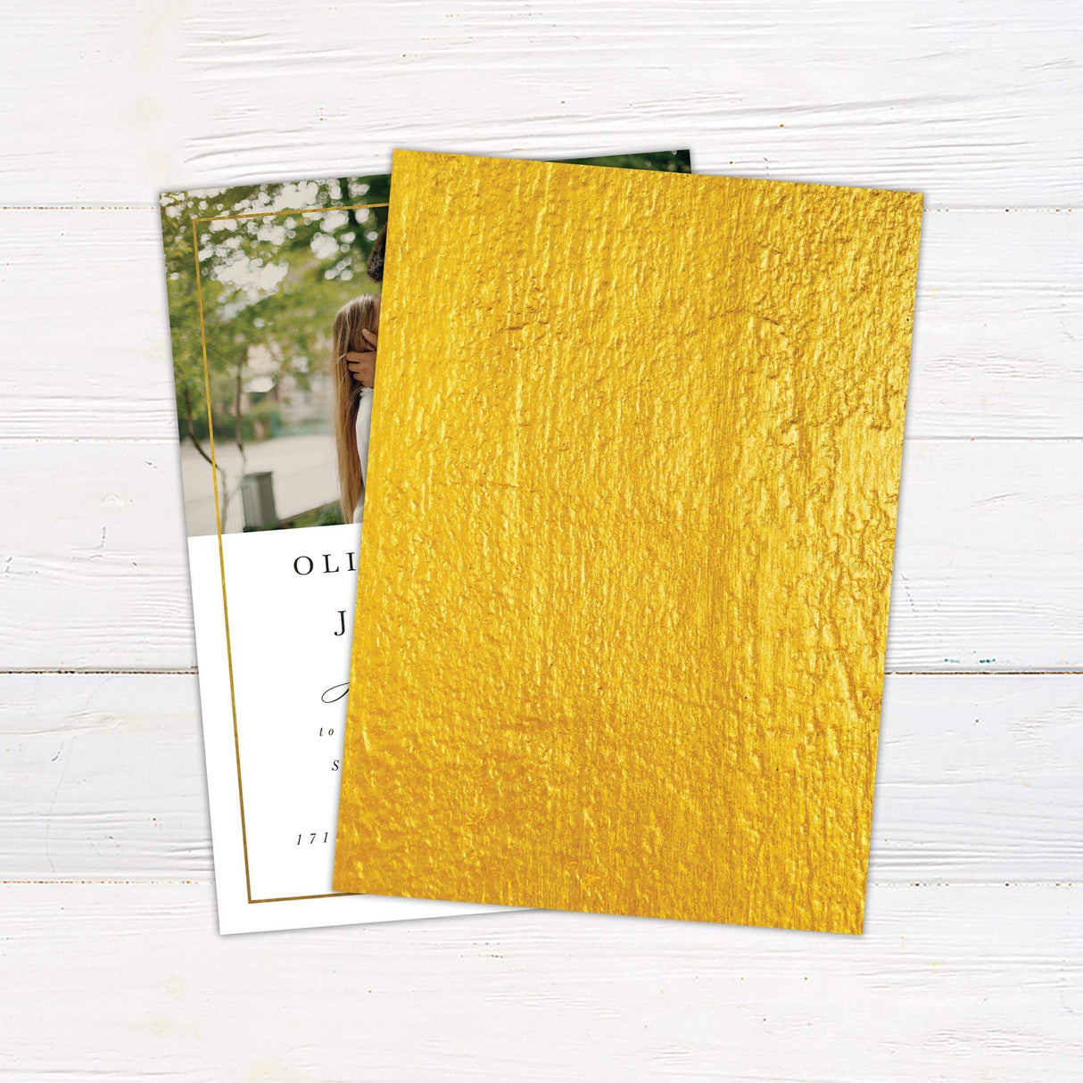 Wedding invitation with gold foil frame, and elegant serif and script fonts on a white background. - back side