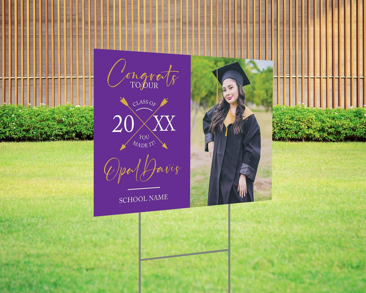 Custom graduation yard sign with a split design, featuring a graduate’s photo on one side and a modern crossed arrows Class Year design with custom school name on the other. Printed on weatherproof Coreplast plastic, available in custom colors and single or double-sided print, perfect for high school and college graduates. Purple