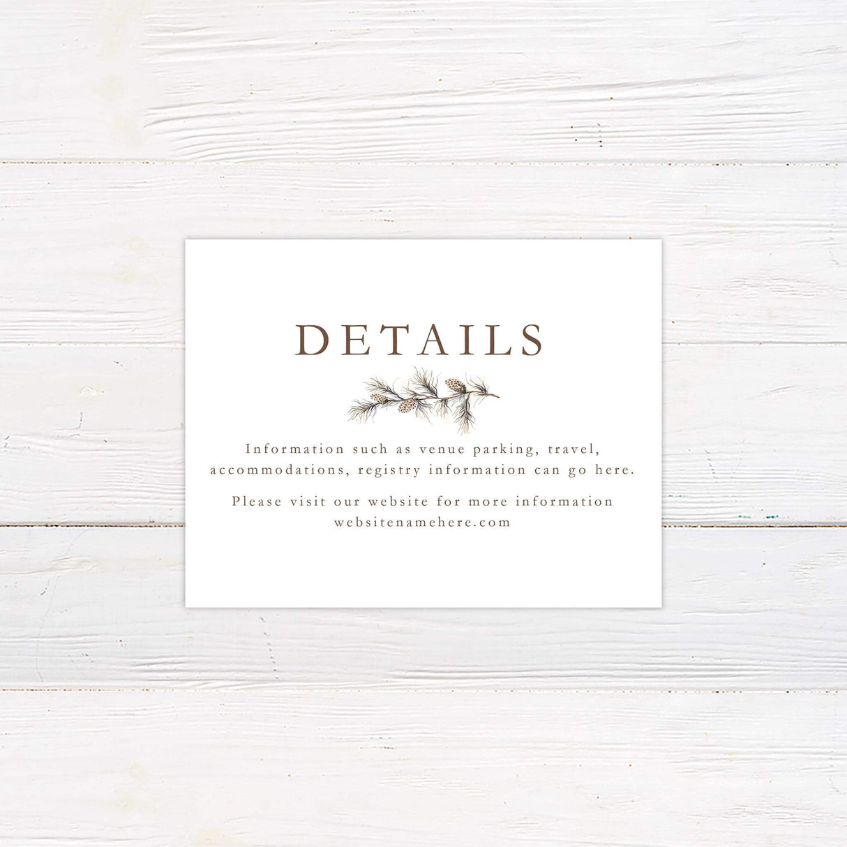 Wedding detail card featuring pine greenery design and clean classic font pairing