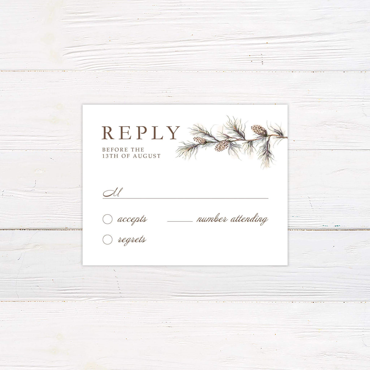 RSVP card with matching pinecone and branch artwork and neutral serif font layout.
