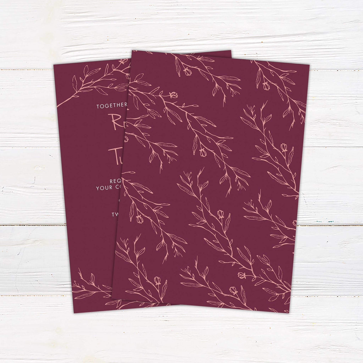 Blush pink botanical wedding invitation back with handwritten script on plum background, printed on matte cardstock