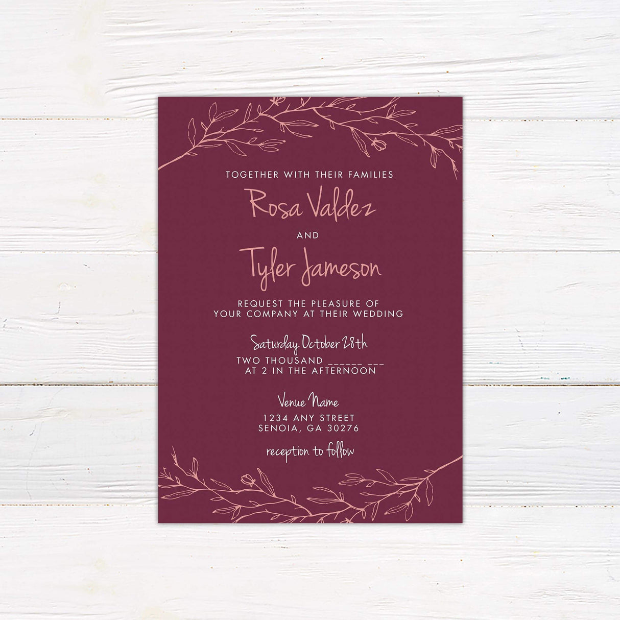 Blush pink botanical wedding invitation with handwritten script on plum background, printed on matte cardstock
