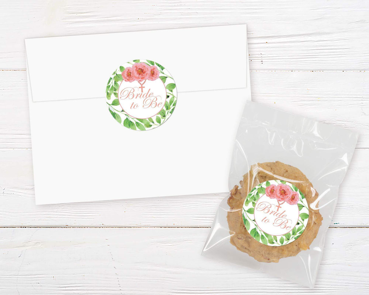 A pink cross floral invitation sticker with watercolor flowers and a cross design. The layout features soft colors and elegant text.