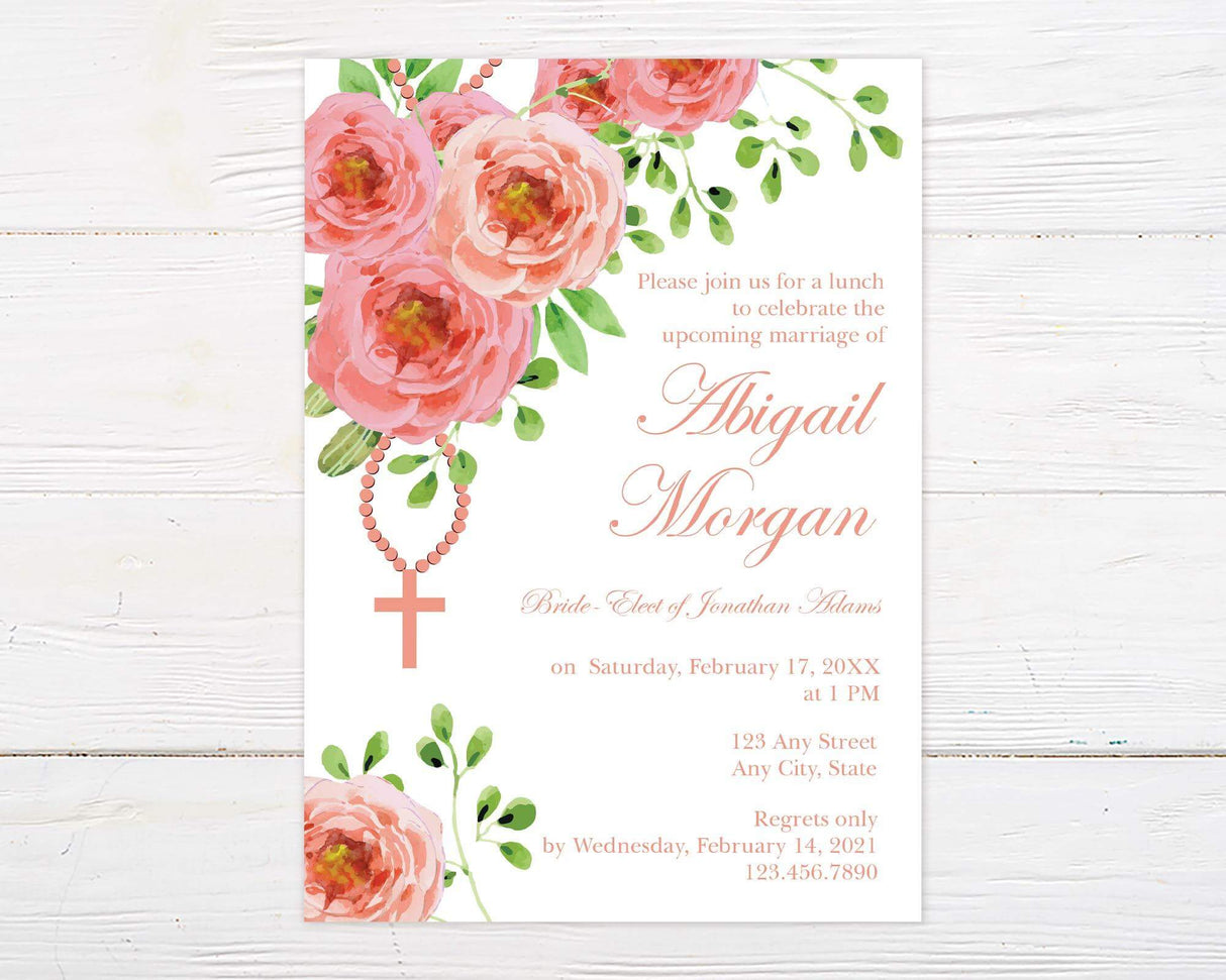 A pink cross floral invitation with watercolor flowers and a cross design. The layout features soft colors and elegant text.
