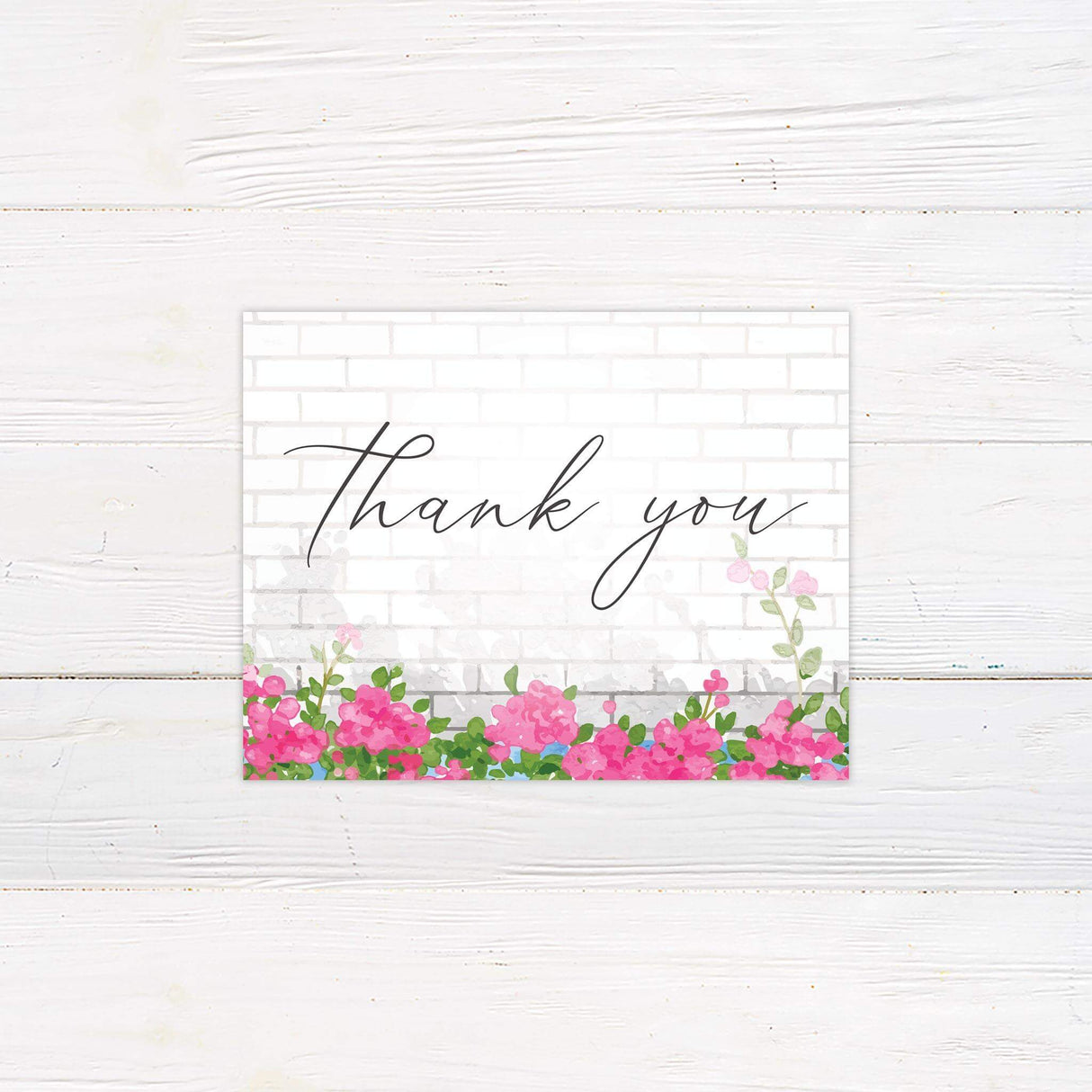 Thank you card with watercolor pink floral arch and simple elegant fonts.