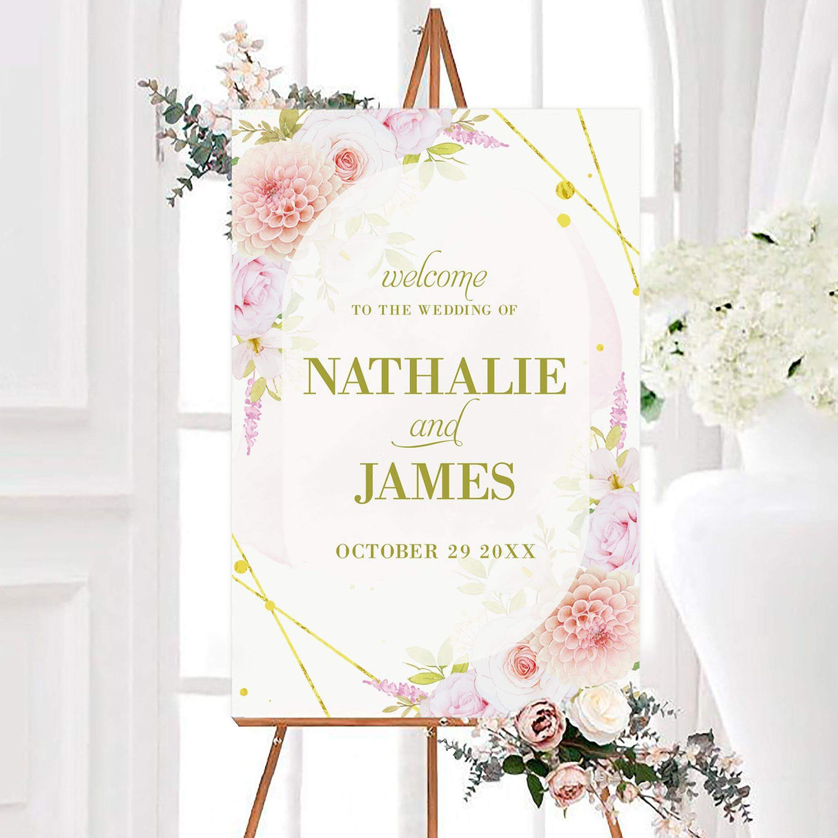 Pink floral border wedding welcome sign with watercolor roses, dahlias, greenery, and gold geometric accents. Personalized olive-gold lettering displays the couple’s names and wedding date.